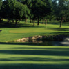 A view of green protected by bunkers at Meadowbrook Country Club