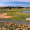 A view of green protected by bunkers and water coming into play at Broadlands Golf Club