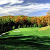 A fall view of green protected by sand traps at Black Bear Golf Club