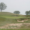 Bunkers surround the green on the 200-yard 16th hole at Erin Hills Golf Course. 