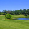 A view of green surrounded by water at Brighton Dale Links